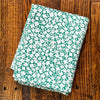 Ivory Mini Flowers Field on Green Double Brushed Poly Spandex