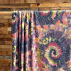 Neon Spiral Tie Dye on Dark Grey French Terry Poly Rayon Spandex